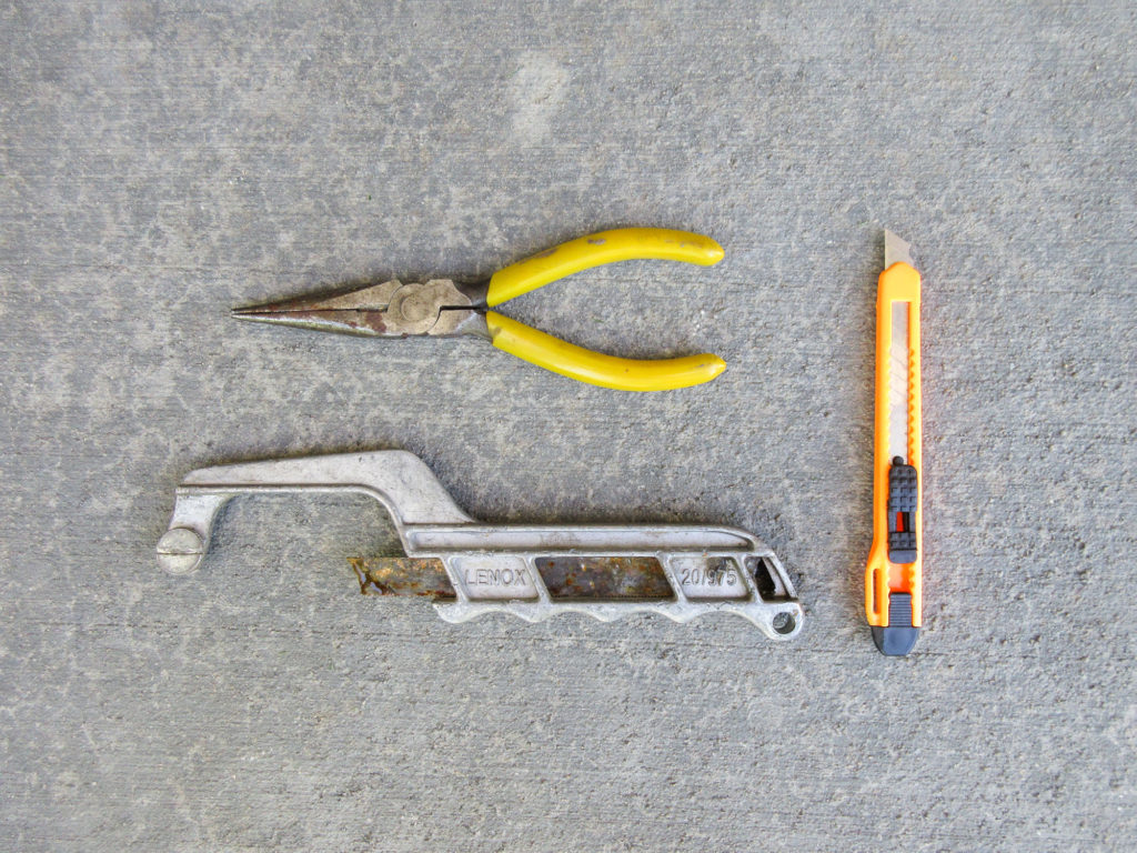 Needle-nose pliers, box cutter and mini hacksaw