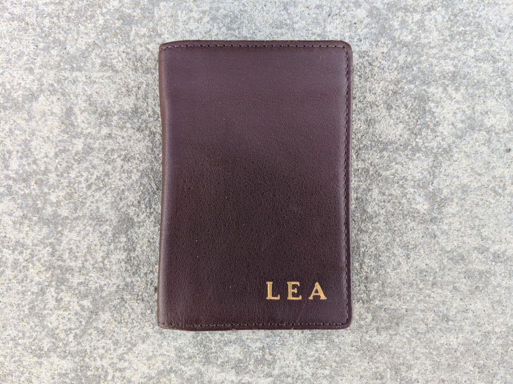 Front of brown leather wallet with initials "LEA"