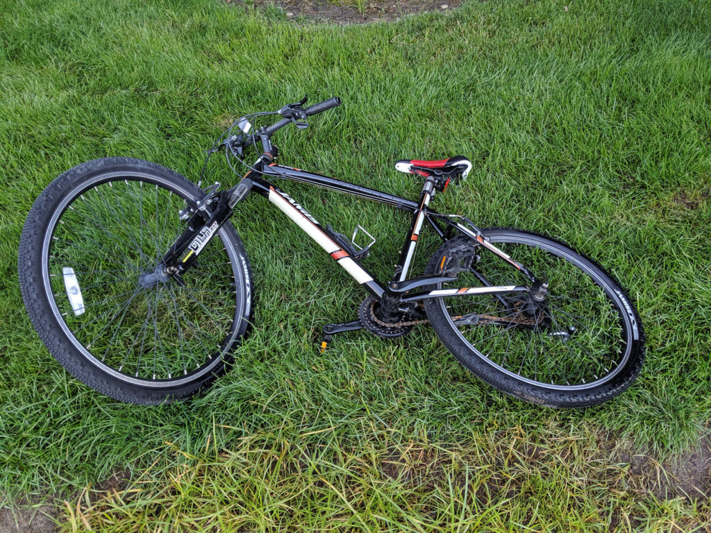 Jamis mountain bike laying on the grass