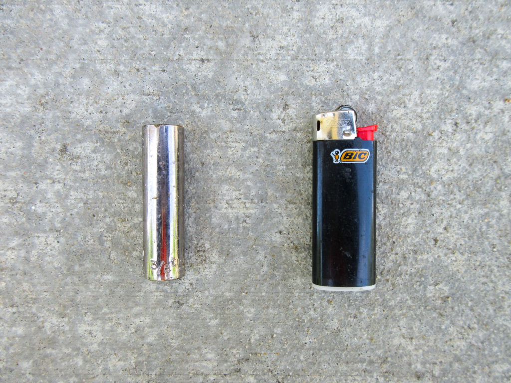 3/8" deep socket and black BIC lighter