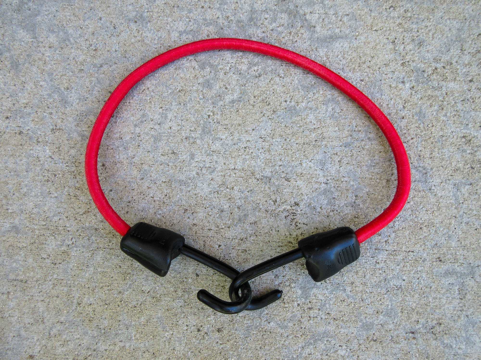 Brand-new-looking red bungee cord