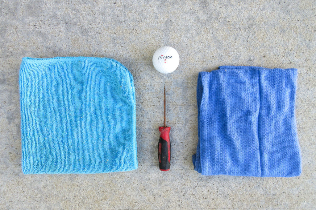 Blue microfiber cloth, blue work rag, pick tool, Pinnacle golf ball