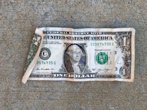 Slightly-crumpled dollar bill