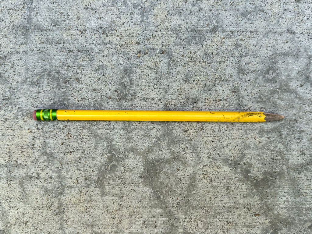 Yellow pencil with a few scuff marks