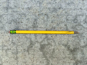 Yellow pencil with a few scuff marks