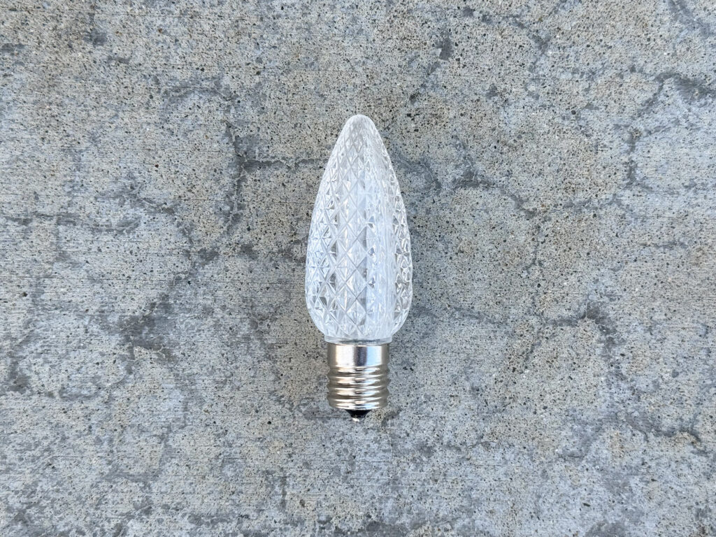 Clear, faceted Christmas light bulb