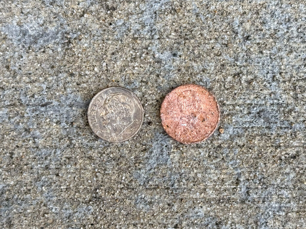 Worn dime and penny, both heads-up