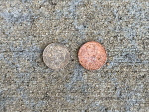 Worn dime and penny, both heads-up
